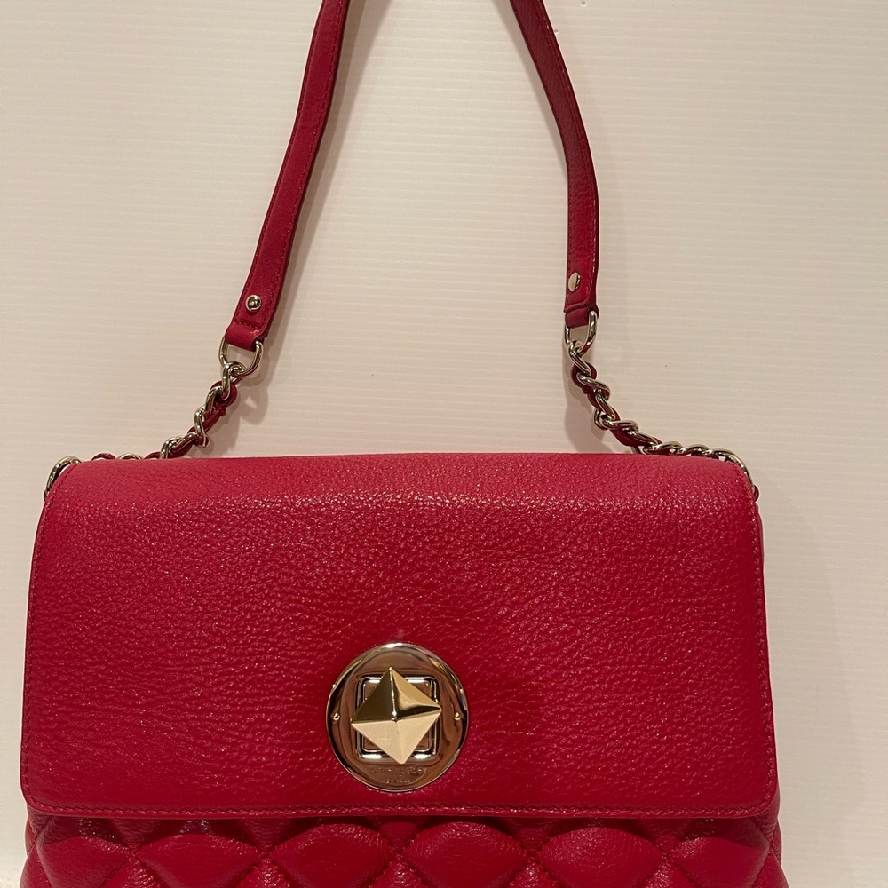 Kate Spade red quilted flag closure shoulder hand bag .